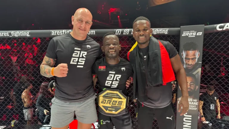 CoreCraft coach Niel cageside with an ARES Fighting Championship title winner and his belt
